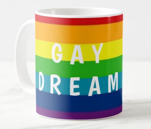 Rainbow Mug with "GAY DREAM" written in white letters. 